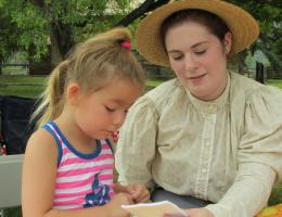 Woman and child making a craft together